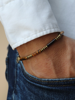 Bracelet on an elastic band with khaki cubic zirconia and natural pearl