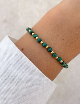 Bracelet on an elastic band with khaki cubic zirconia and natural pearl