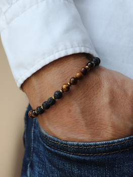 Bracelet on an elastic band with khaki cubic zirconia and natural pearl