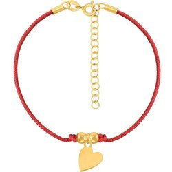 A rope bracelet with a heart on a red string and a gold-plated clasp