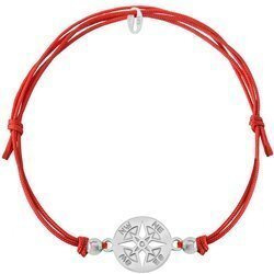 A red string bracelet with a wind rose pendant