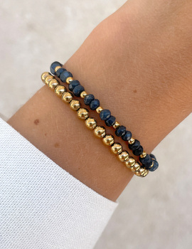 Bracelet on an elastic band with khaki cubic zirconia and natural pearl