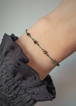 Bracelet made of natural zoisite stones with ruby, silk thread