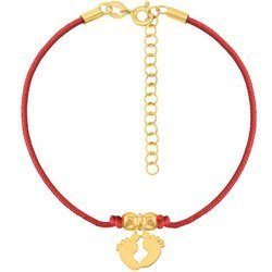 A rope bracelet with feet on a red string and a gold-plated clasp