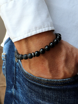 Bracelet on an elastic band with khaki cubic zirconia and natural pearl