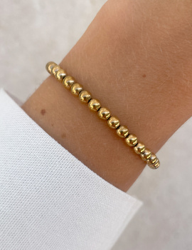 Bracelet on an elastic band with khaki cubic zirconia and natural pearl